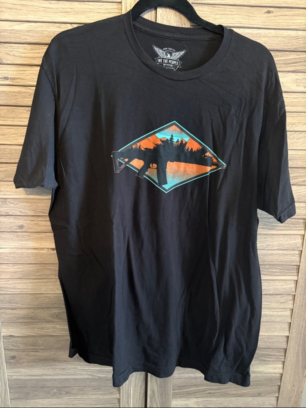 Black Short-Sleeve Graphic Tee with Orange & Teal Landscape Rifle Silhouette